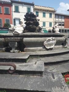 The 17th century Medici Fountain in the main piazza of Fivizzano, Italy.